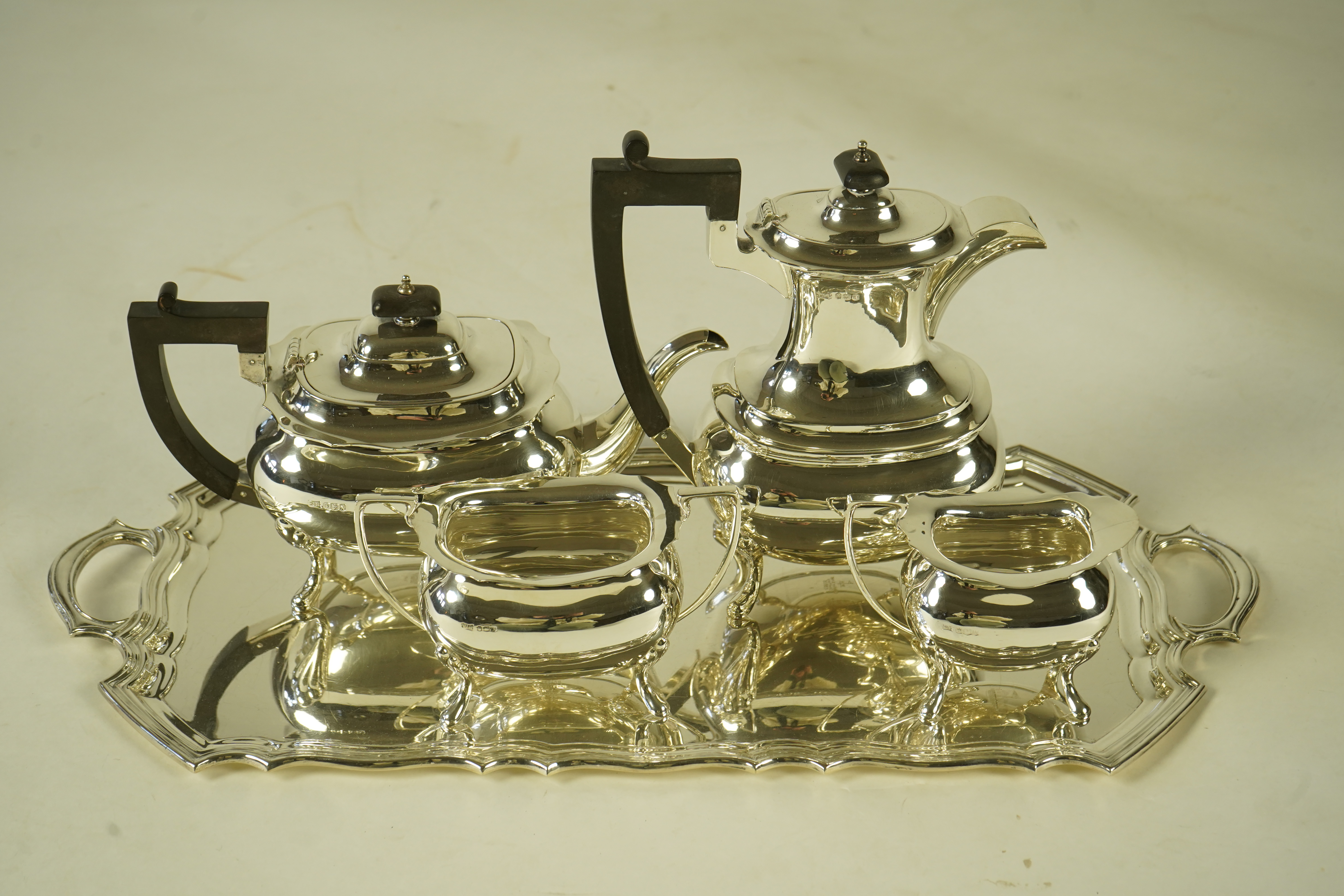 An Elizabeth II silver four piece tea service and two handled tea tray, by Walker & Hall